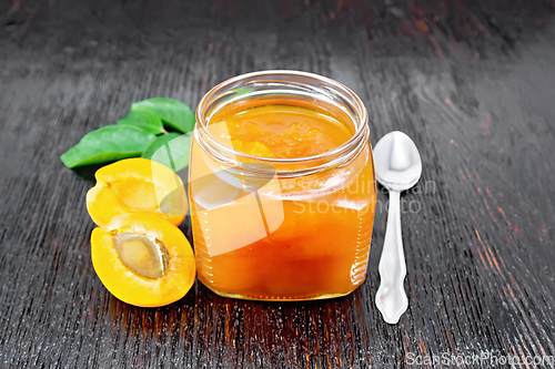 Image of Jam apricot in jar on black board