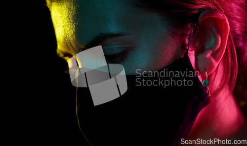 Image of young woman wearing reusable protective mask