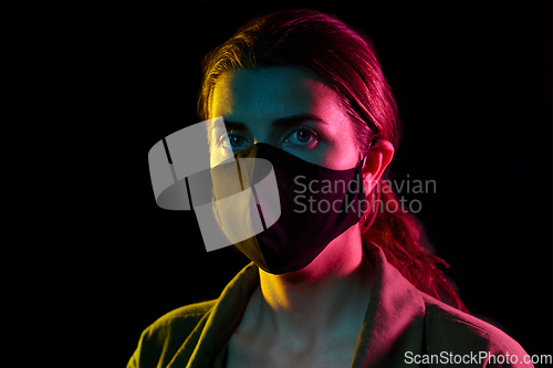 Image of young woman wearing reusable protective mask