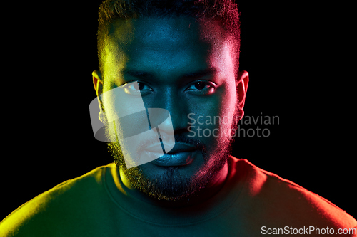 Image of young african american man over black background