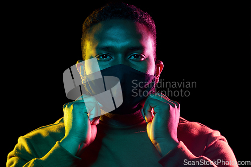 Image of african american man wearing black reusable mask