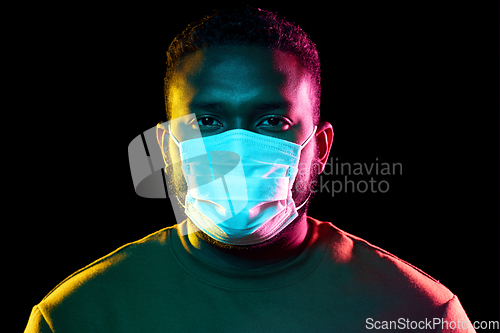 Image of african american man wearing medical mask