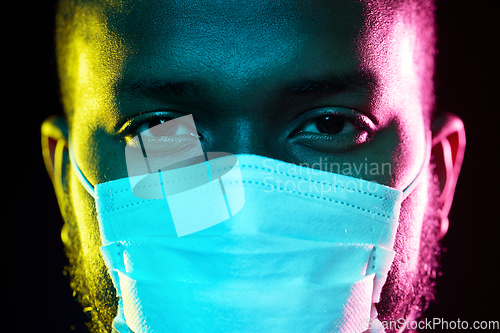 Image of african american man wearing medical mask