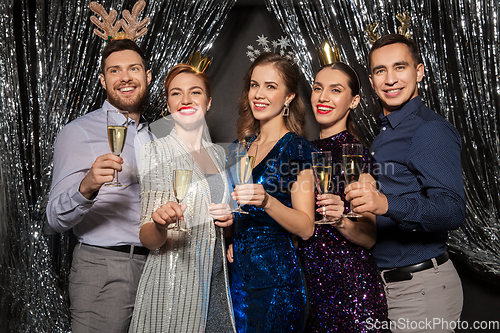 Image of friends with champagne glasses at christmas party