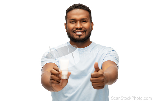 Image of african man with moisturizer showing thumbs up