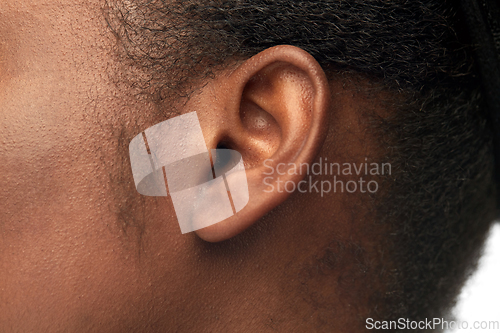 Image of close up of african american woman's ear