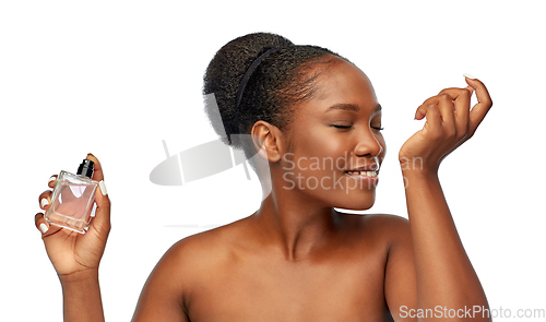 Image of young african american woman with perfume