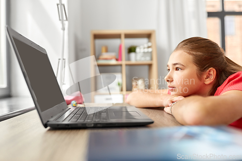 Image of student girl with laptop computer learning at home