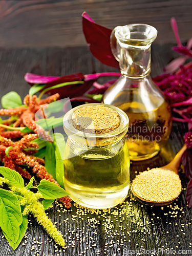 Image of Oil amaranth in jar on dark board