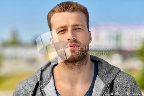 Image of portrait of young man outdoors