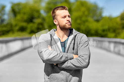Image of portrait of young man outdoors