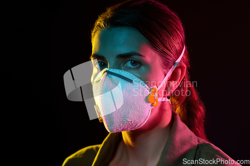 Image of young woman wearing protective mask or respirator