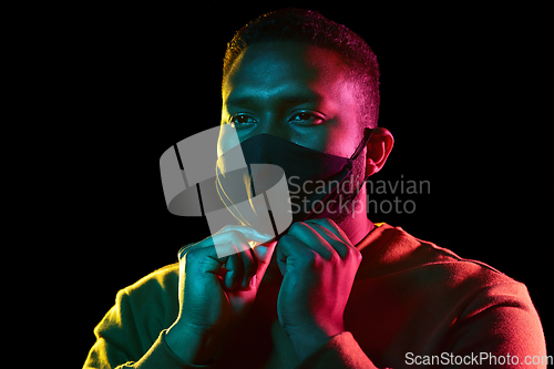 Image of african american man wearing black reusable mask