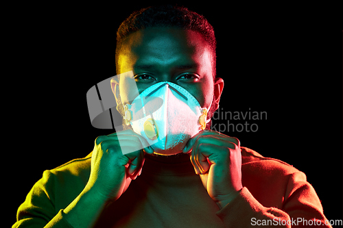 Image of african american man in mask or respirator