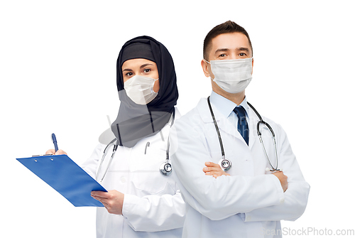 Image of doctors in masks with clipboard and stethoscope