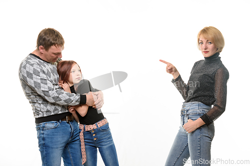 Image of Mom scolds daughter, father takes pity on daughter, isolated on white background