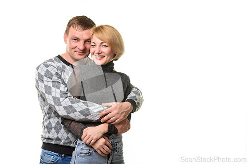 Image of Portrait of a young couple, a man hugging a woman, isolated on a white background