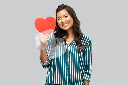 Image of happy asian woman with red heart