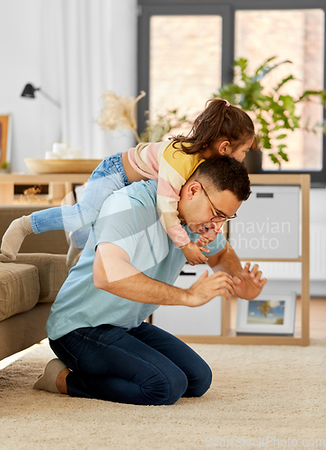 Image of happy father with little daughter at home