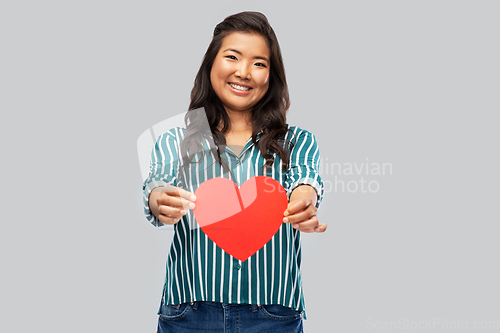 Image of happy asian woman with red heart