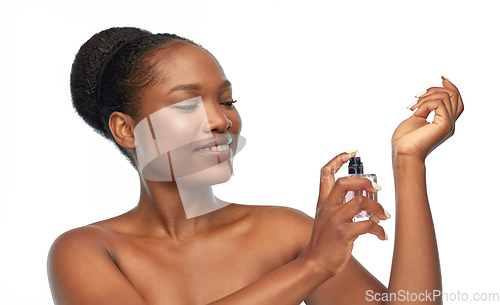 Image of young african american woman with perfume