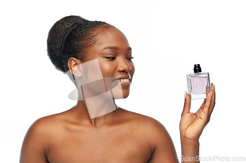 Image of young african american woman with perfume