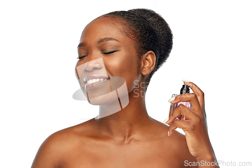 Image of young african american woman with perfume