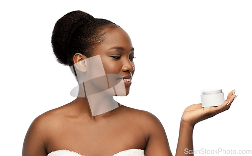 Image of smiling african american woman with moisturizer