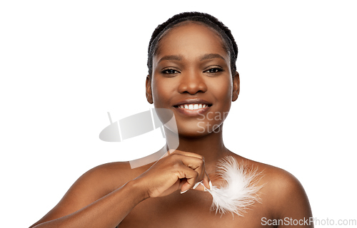 Image of happy african american woman with feather