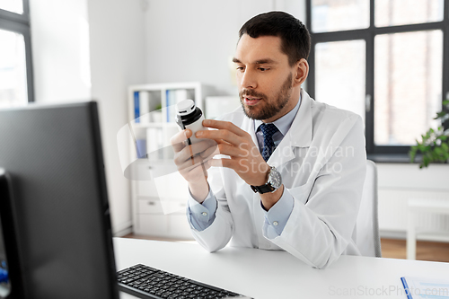 Image of male doctor with medicine at hospital