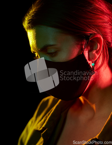 Image of young woman wearing reusable protective mask