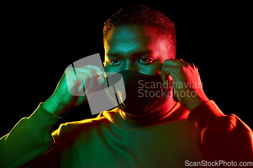 Image of african american man wearing black reusable mask