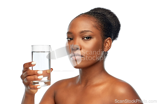 Image of young african american woman with glass of water