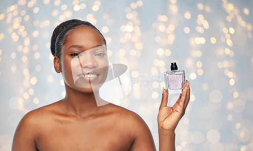 Image of young african american woman with perfume