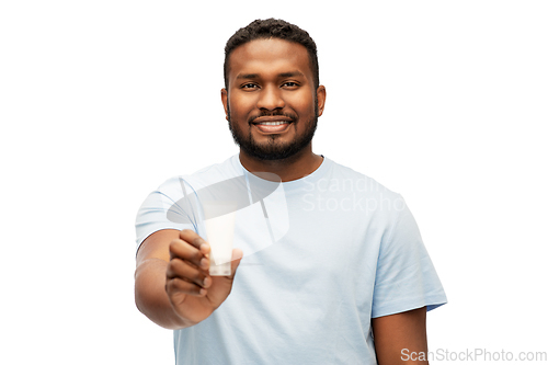 Image of happy african american man showing moisturizer