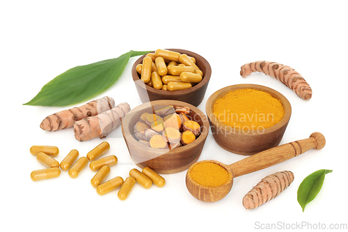 Image of Fresh Turmeric Health Food with Powder and Pills