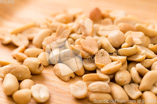 Image of Pile Peanut on woodn background