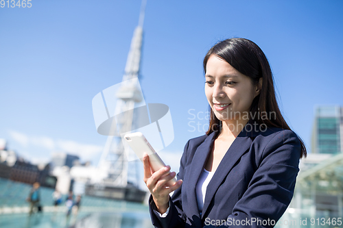 Image of Asian business woman use of cellphone