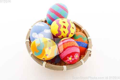 Image of Colourful Easter eggs in a basket
