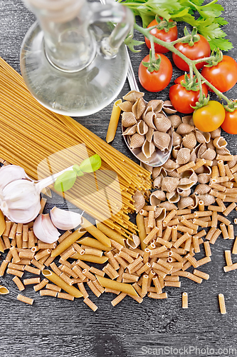 Image of Pasta different whole grain and rye on dark board top