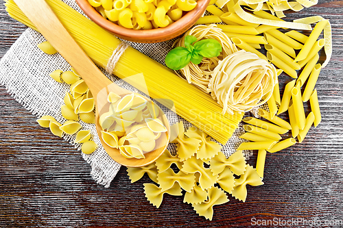 Image of Pasta different with basil on board top