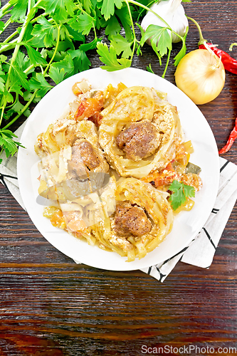 Image of Pasta with meatballs in plate on dark board top