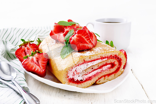 Image of Roll with cream and strawberries in plate on white board