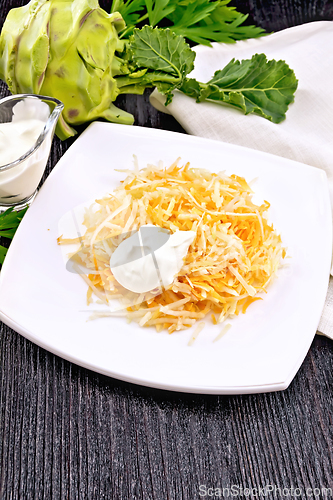 Image of Salad of carrot and kohlrabi with sour cream in plate on board