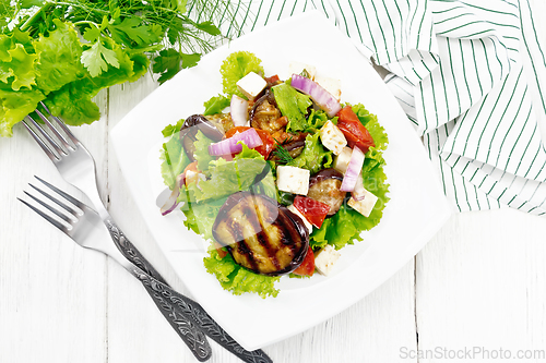 Image of Salad of eggplant with cheese and tomatoes on board top