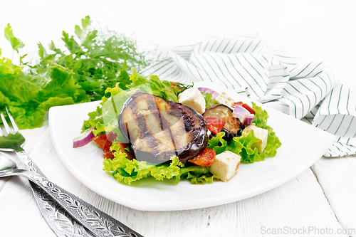 Image of Salad of eggplant with cheese and tomatoes on board