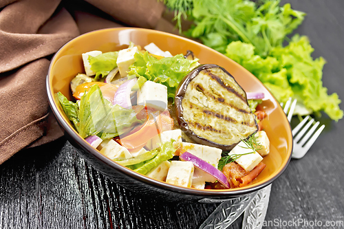 Image of Salad of eggplant with feta and tomatoes on table