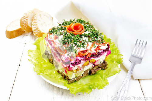 Image of Salad with beef and vegetables on light table