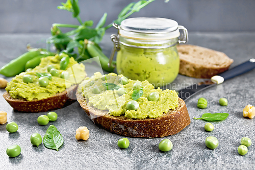 Image of Sandwich green pea hummus on stone granite table