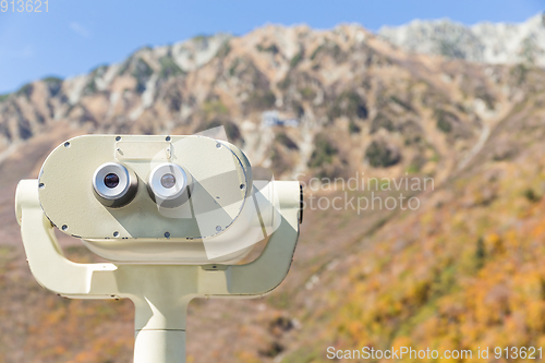 Image of Coin Operated Binocular viewer for tourist with the background o